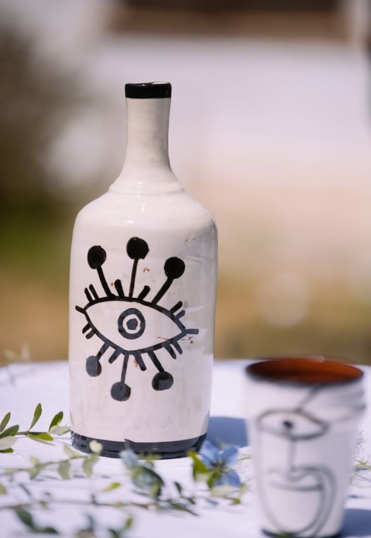 Bouteille en céramique œil noir et blanc