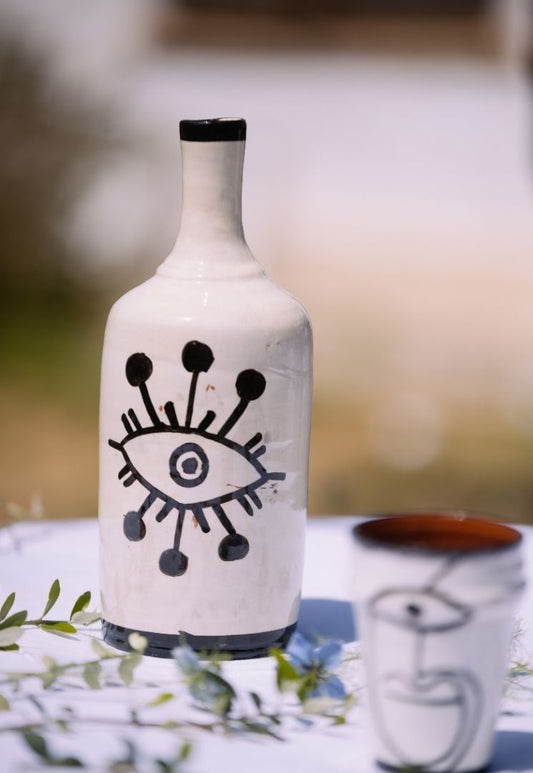 Bouteille en céramique œil noir et blanc