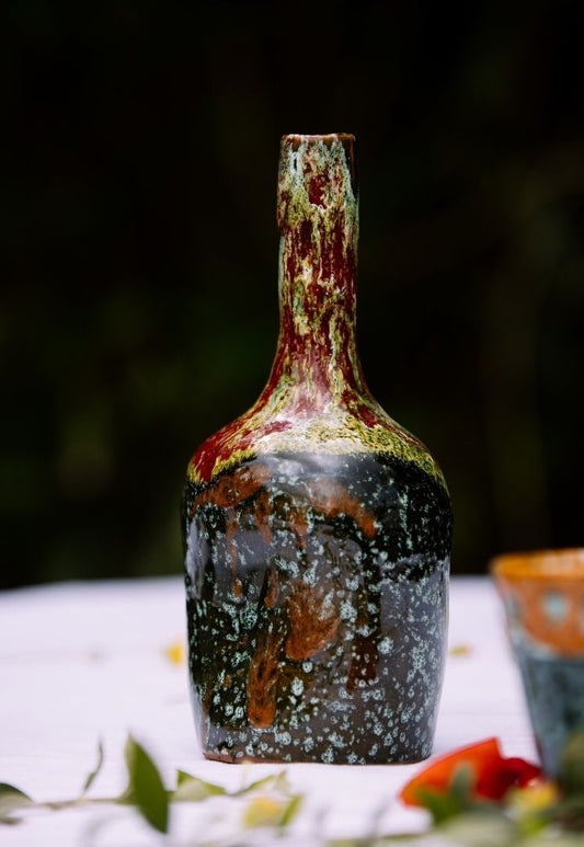 Bouteille en céramique vintage rouge et bleu